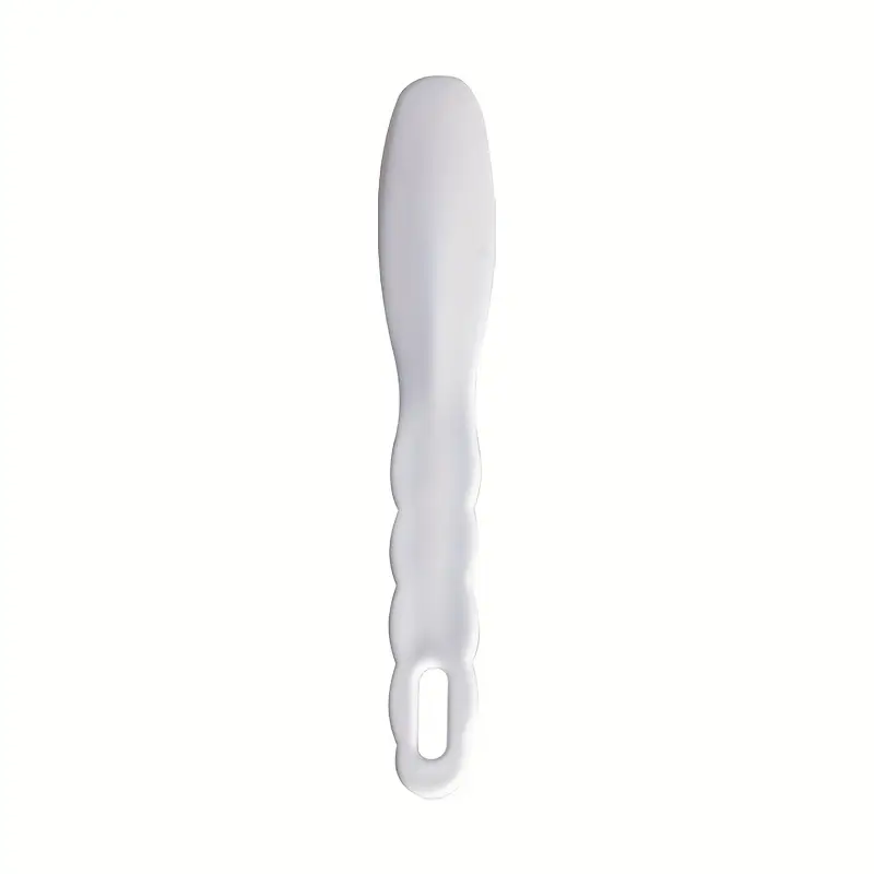 This is a White Plastic Mixing Spatula Impression Material